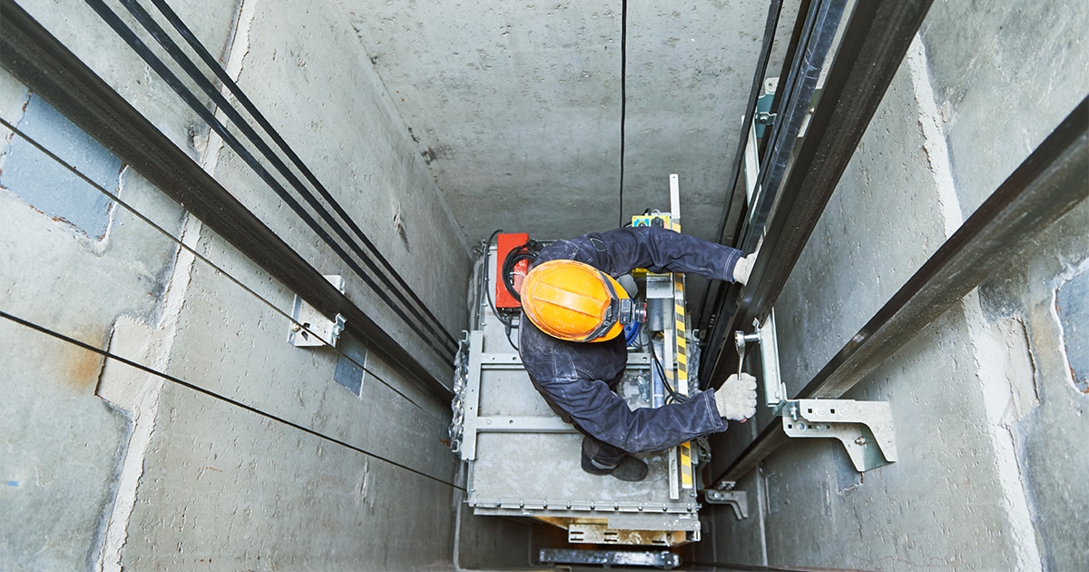 Engineer working in elevator shaft