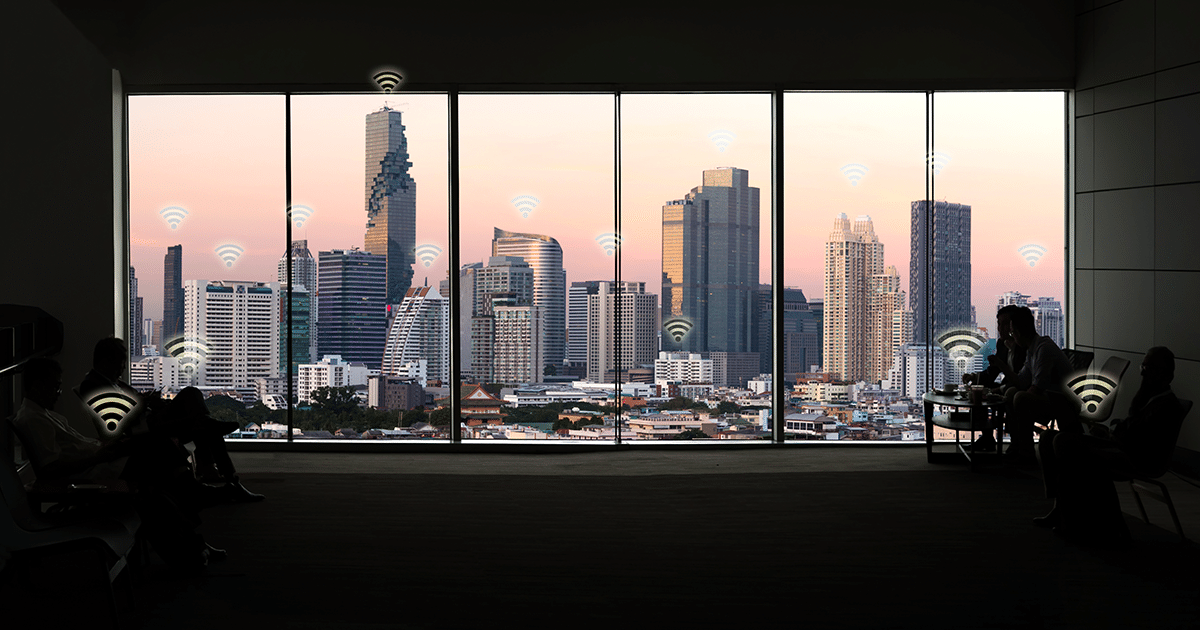 Window view of city skyline with wifi icons graph