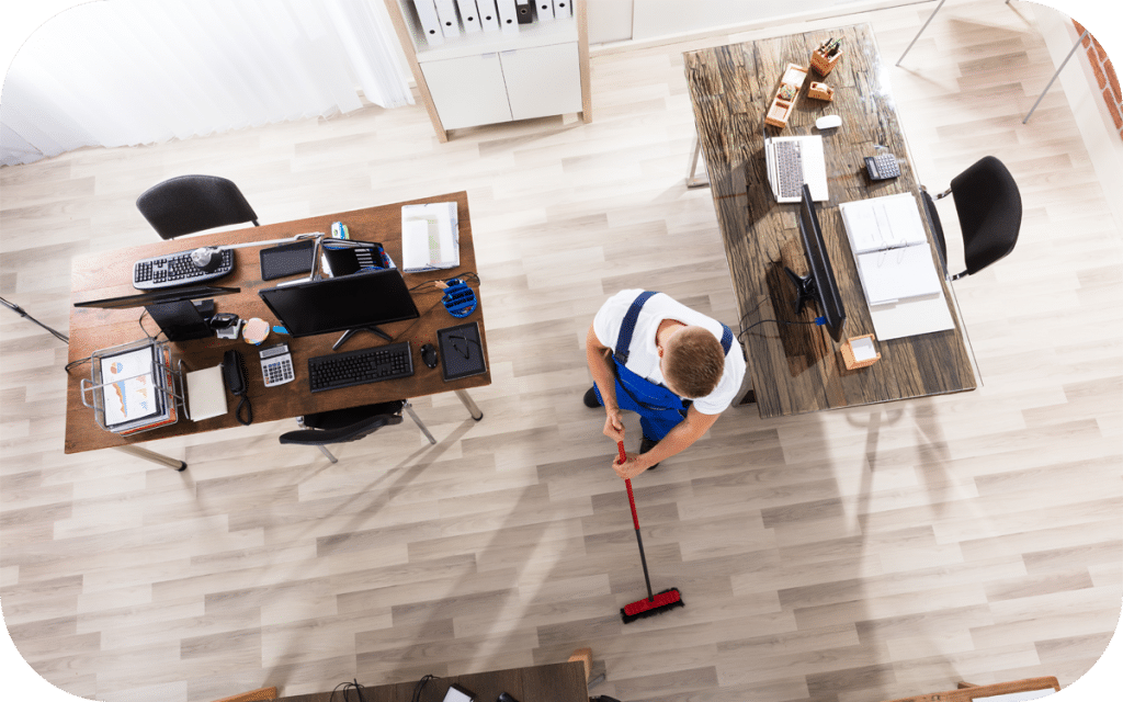 A person sweeping the floor with a mop